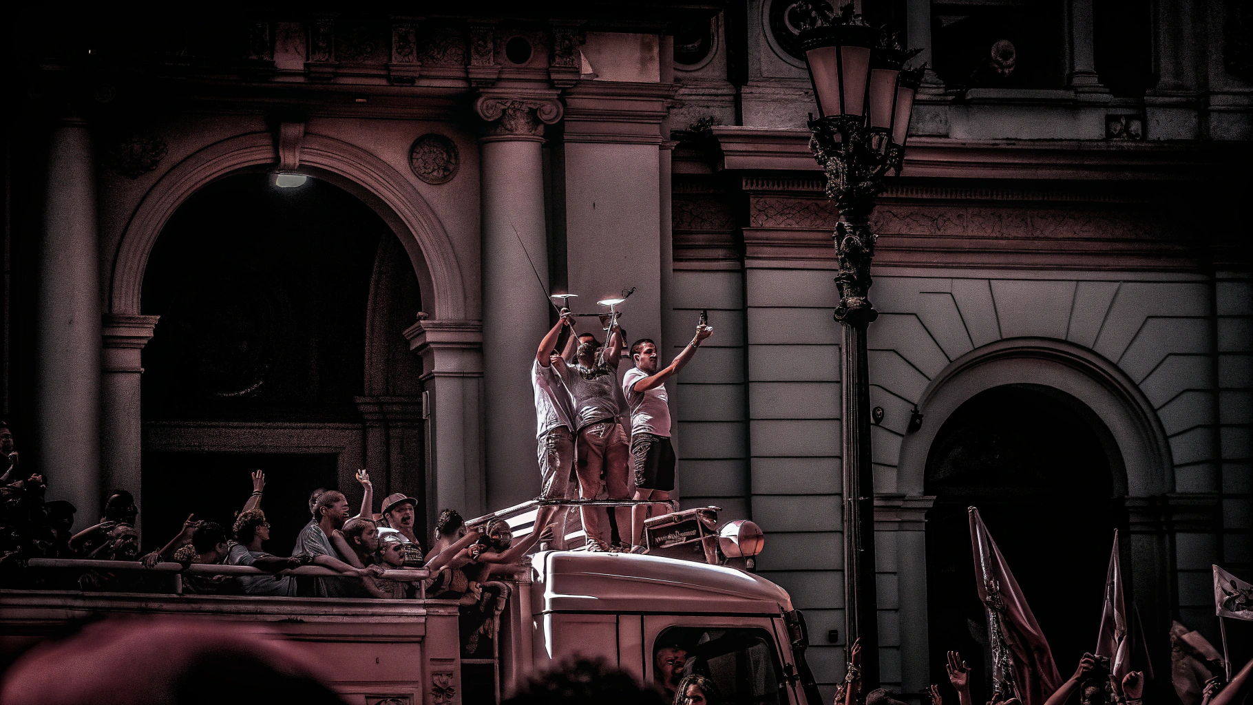 AI generated image by Red Panda AI: players from the Brazilian and Argentine national teams on top of a fire truck celebrating a World Cup victory together in Buenos Aires' most famous square with fans around them