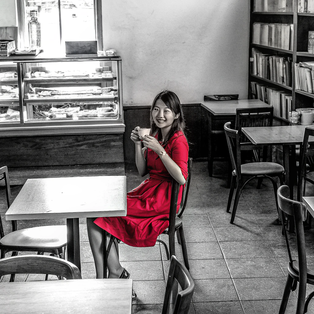 AI generated image by FLUX.1-schnell: Taiwanese girl in a red dress at a cafe