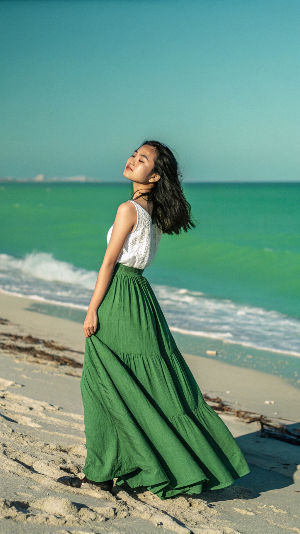 AI generated image by Red Panda AI: a beautiful asian girl standing on the beach, with green long skirt,look at viewer, only two blue and green two colors, green as background color,2k