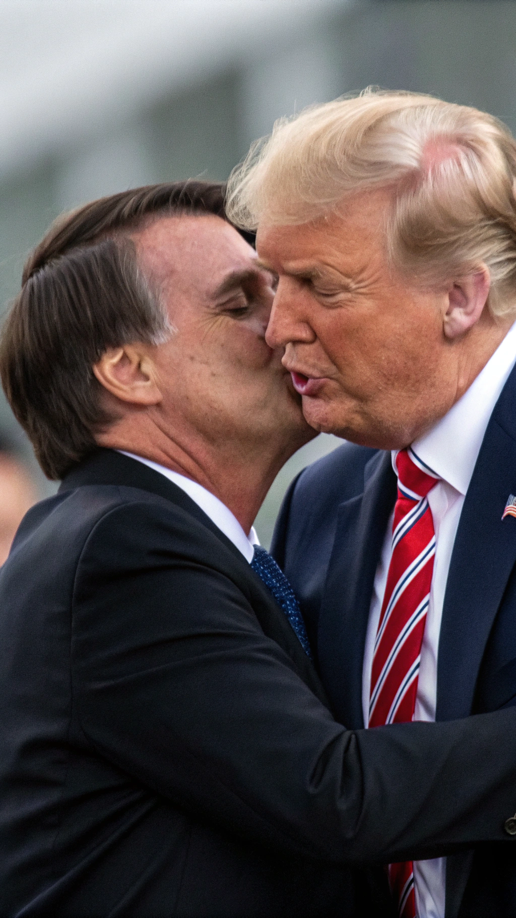 AI generated image by Red Panda AI: Jair Bolsonaro giving Donald Trump a romantic and passionate kiss.