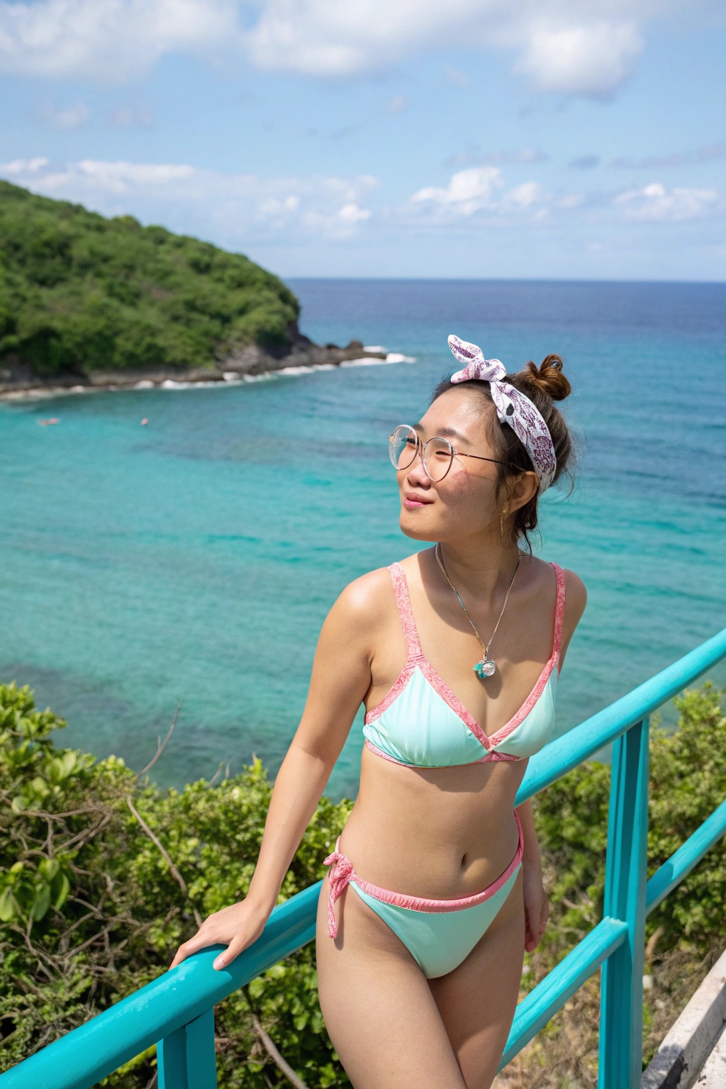 AI generated image by Red Panda AI: Prompt:Casual outdoor Portrait, Front Angle, Eye-level Shot A young Asian woman enjoying a sunny day by the ocean, standing confidently with a soft smile and open eyes. She wears a pastel-colored bikini, featuring a light mint green shade with pink borders, adding a playful contrast. Her casual hairstyle is held by a checkered scrunchie, complementing her relaxed look. She has round glasses and a delicate heart-shaped pendant necklace, enhancing her gentle and serene expression. The turquoise-colored railing in the foreground contrasts with the deep blue ocean and lush greenery in the background, creating a vibrant and peaceful beachside atmosphere.