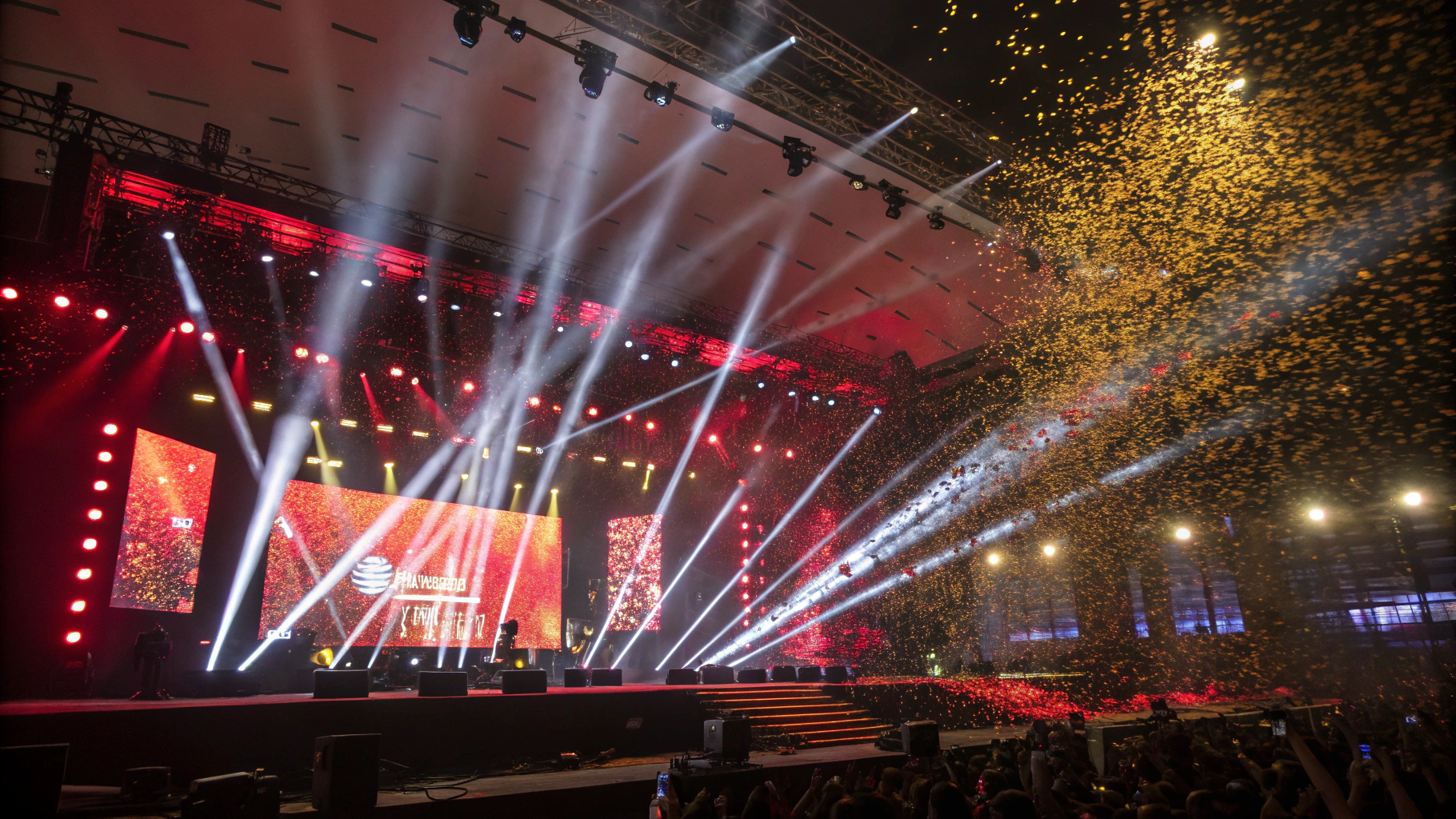 AI generated image by Red Panda AI: Big concert stage with moving white and color spot lights. Explosions of red and gold confetti.