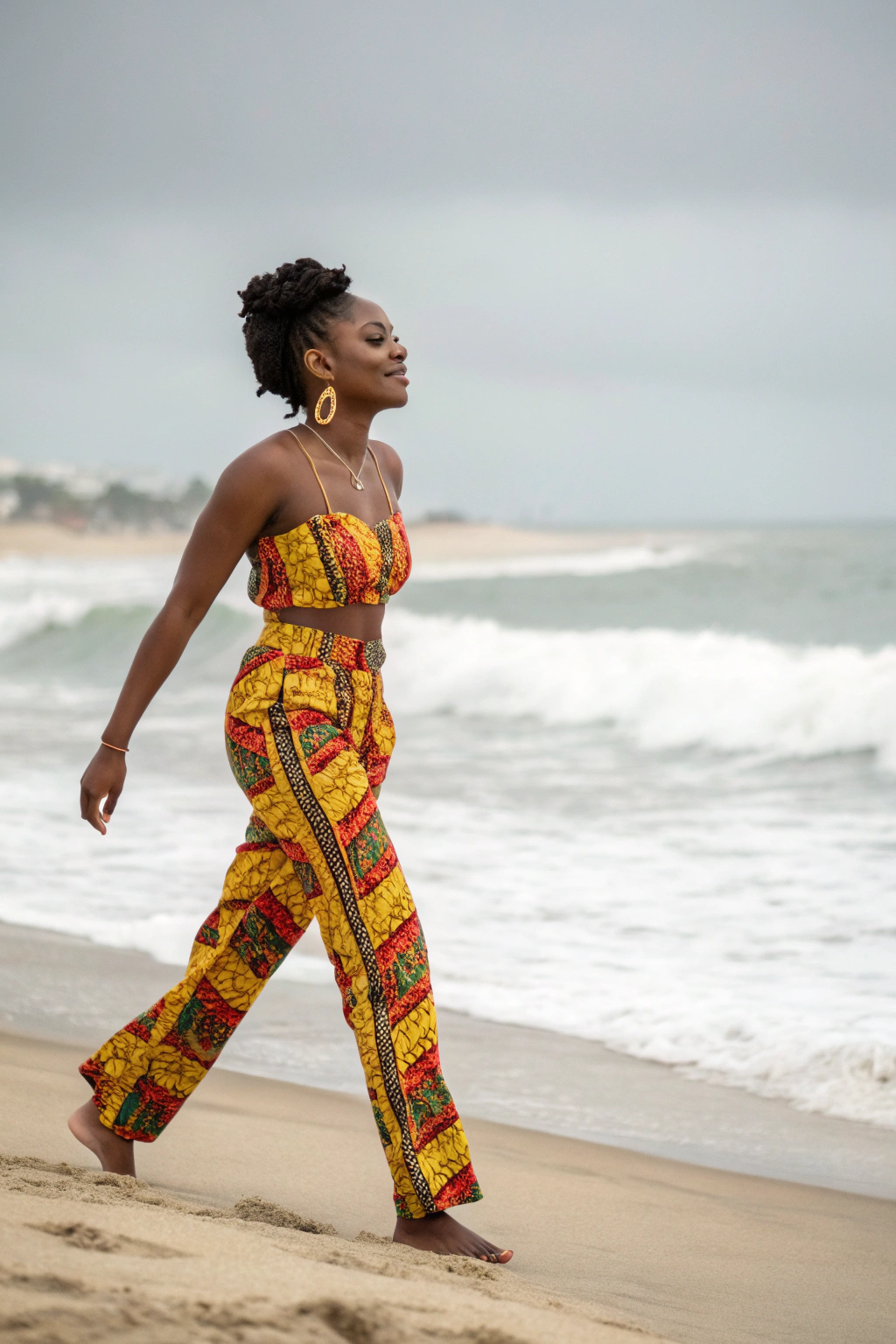 AI generated image by Red Panda AI: Fashion Photography, a stunningly beautiful Black woman in her late 20s exuding confidence and grace. She’s dressed in a modern Ankara pantsuit, the combination of African colors creating a bold statement at a summer beach during a light drizzle. The attire features intricate Ghana kente patterns, symbolizing faith and protection. Shot at eye level with a Canon 5D Mark IV and an 85mm lens, the framing captures her full body, her confident stride toward the camera, with one hand resting on her hip, showcasing her poised and elegant posture. The lighting is soft and natural, with a shallow depth of field that keeps the focus on her, blurring wet sand in the background.