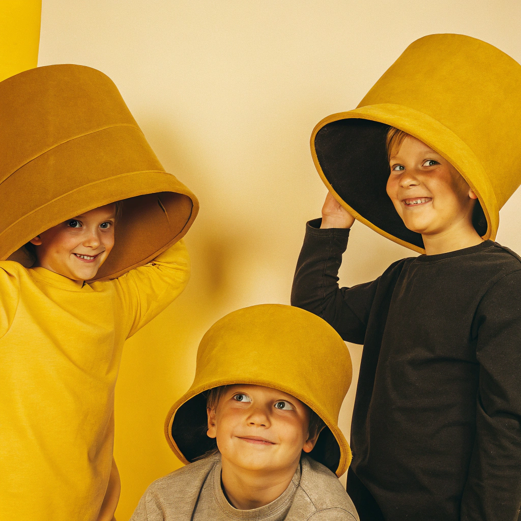 AI generated image by FLUX.1-schnell: Kids wearing oversized cloches and cap