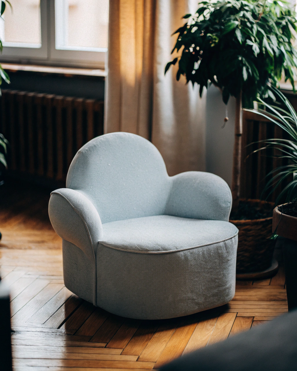 AI generated image by Red Panda AI: The living room features warm wooden flooring that gives the space a cozy, inviting feel. In the center, there is a fluffy white cloud-shaped armchair, its soft, curved edges adding a playful touch to the room. Right next to the sofa, a lush green plant in a simple pot brings a burst of freshness and vibrancy to the space, its leaves contrasting beautifully with the neutral tones of the room. The overall atmosphere is calm and soothing, perfect for relaxation or quiet conversation.