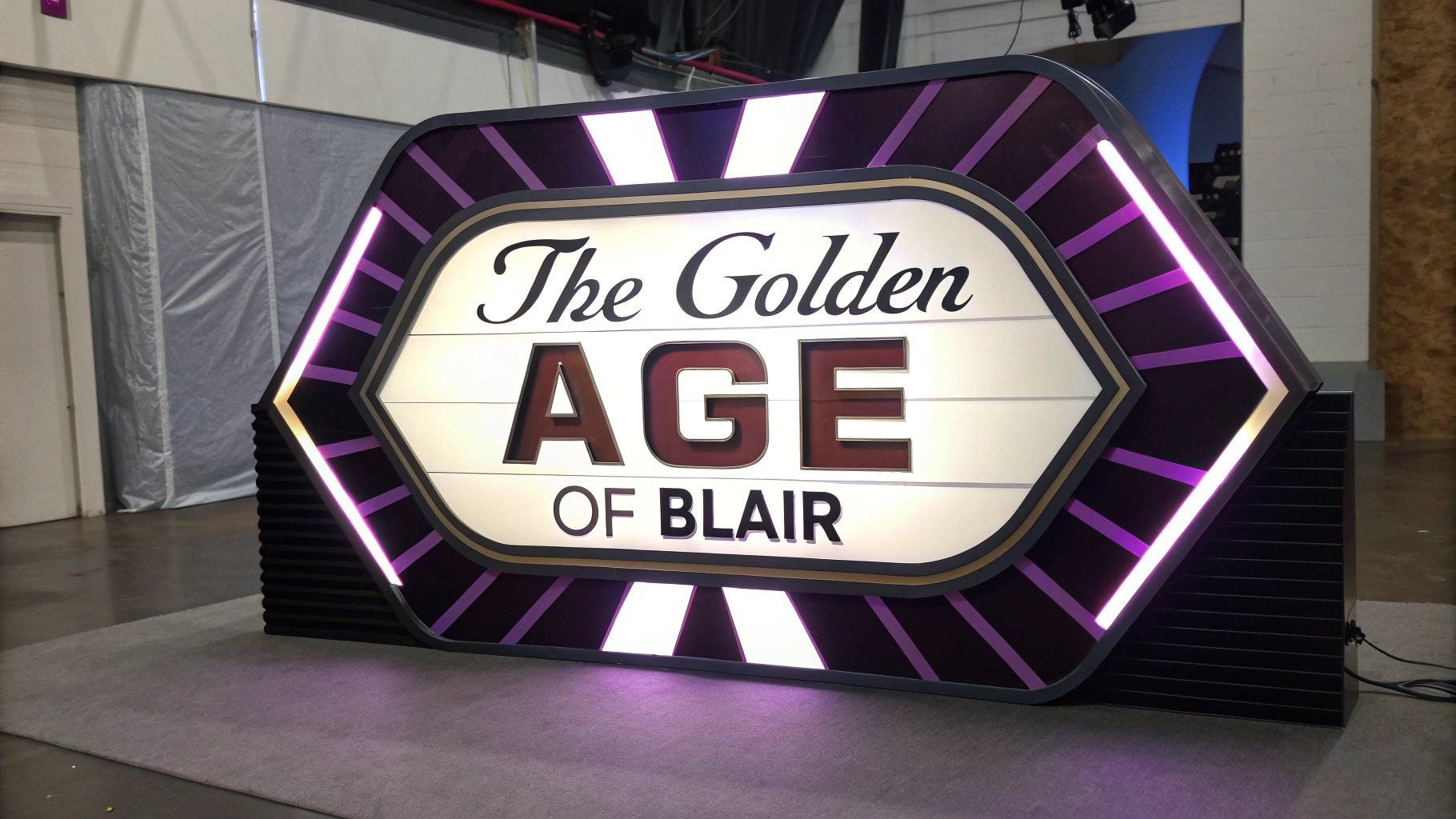 AI generated image by Red Panda AI: sign reads "The Golden Age of Blair", iconic, classic, powerful, futuristic, high tech, modern, color motif is purple and white and black