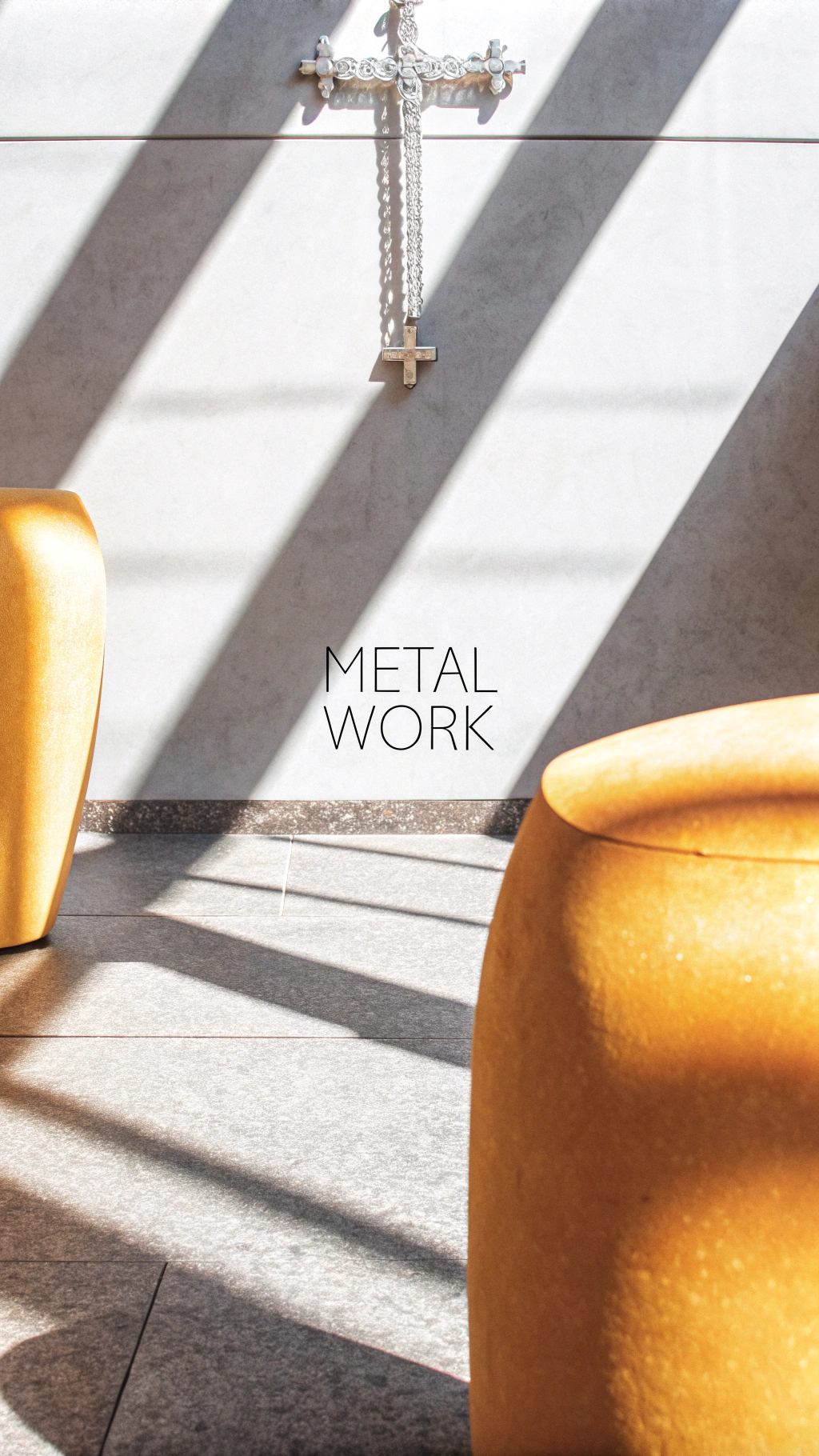 AI generated image by Red Panda AI: Create a minimalist luxury fashion lookbook for a high-end jewelry brand 'Metal work'. The models should have a strong, confident presence with clean, androgynous features, wearing minimal makeup. They should exude cool sophistication, with sleek hair and minimalist clothing.

Focus on showing intricate details of bold jewelry pieces:
Cross-Inspired Necklace: Large cross pendant with fine details and sleek chain.
Sculptural Bracelets: Smooth, curved designs with a polished finish.
Bold Statement Rings: Large, sculptural rings with fine textures and gemstones.

Use high-contrast lighting with dramatic shadows. Soft, natural light for some shots, artificial light to create highlights on the jewelry. Focus on close-up details and full-body compositions.