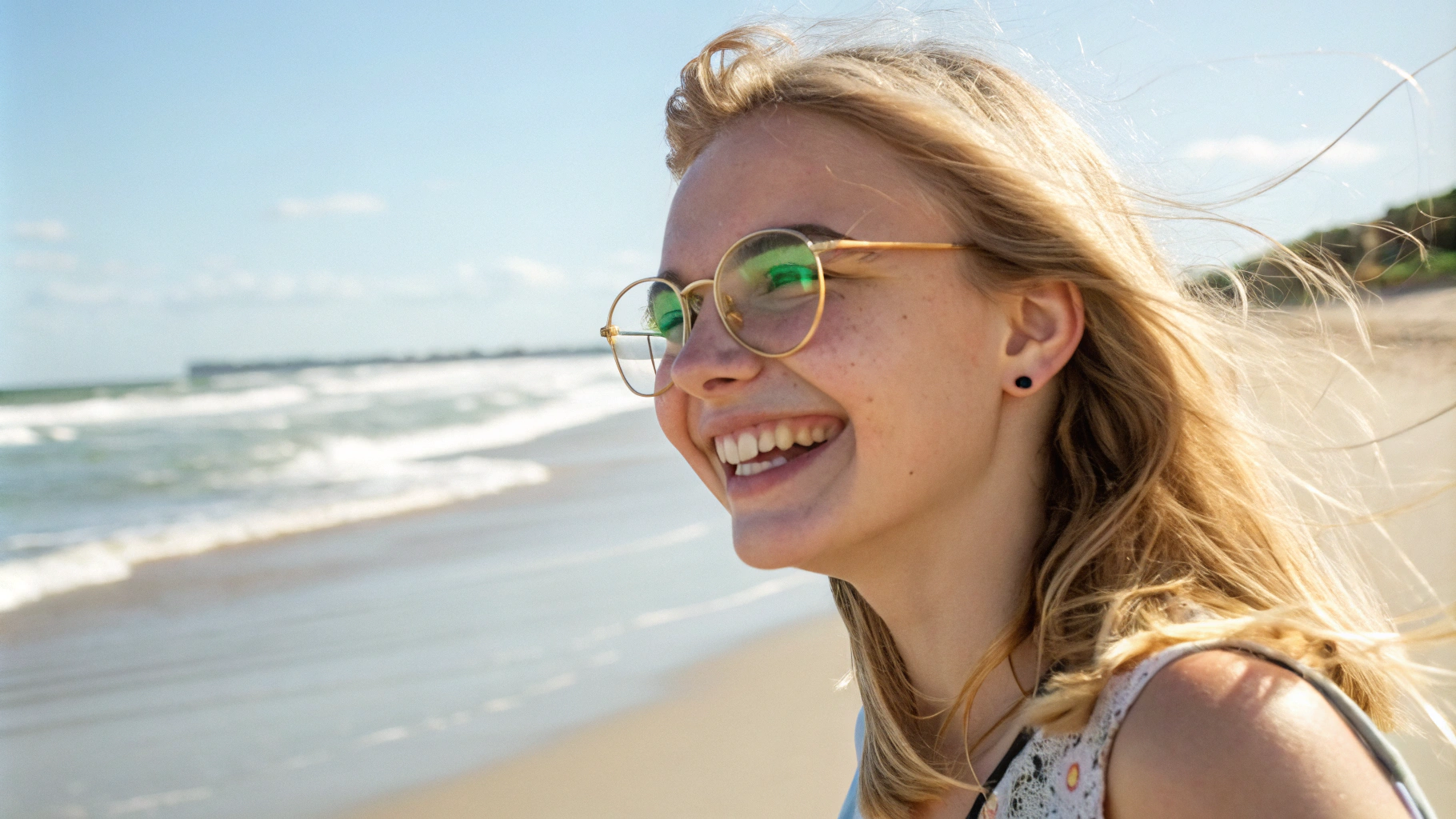 AI generated image by Red Panda AI: A wonderfull girl. She is blonde with green eyes and astonishing smile and she is using glasses with golden frames. She is walking in a beach