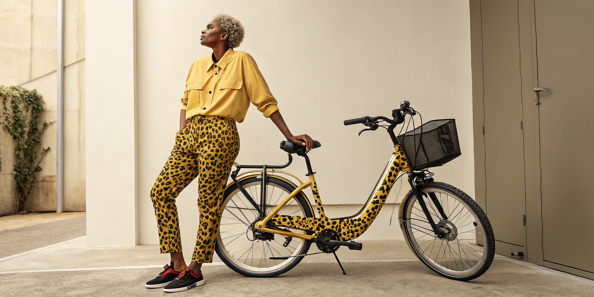 AI generated image by Red Panda AI: Create a highly realistic image of a a person wearing a yellow shirt and a leopard-print pants, standing next to a matching e-bike with a leopard pattern. This person, Maëlle, is very upset, dissatisfied expression, reflecting her disappointment in the lack of customer care after her purchase, which made the experience feel less luxurious.